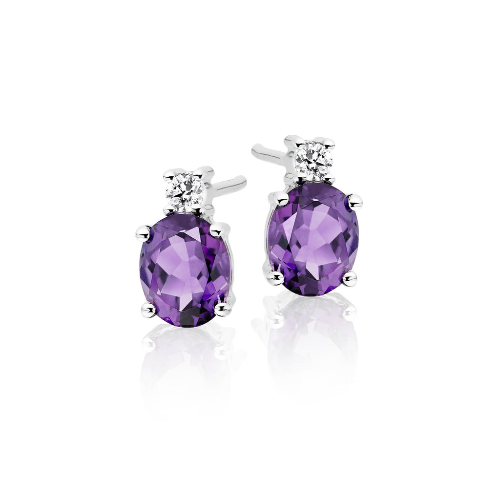 5mm x 7mm Amethyst and 0.07ct diamond stud earrings in 9K white gold