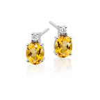 5mm x 7mm Citrine and 0.07ct diamond stud earrings in 18K white gold