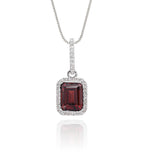 5mm x 8mm Garnet with 0.15ct Diamond pendant in 9K white gold