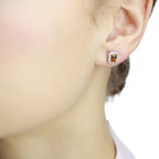 4mm x 6mm Citrine and 0.15ct diamond stud earrings in 9K white gold