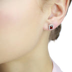 4mm x 6mm Garnet and 0.15ct diamond stud earrings in 9K white gold