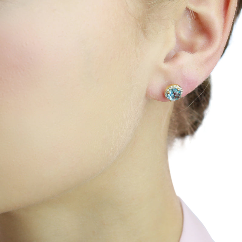 6mm Blue Topaz and 0.12ct diamond stud earrings in 9K yellow gold