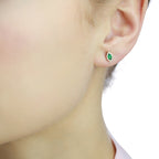 Marquise Emerald and 0.08ct diamond stud earrings in 18K yellow gold 