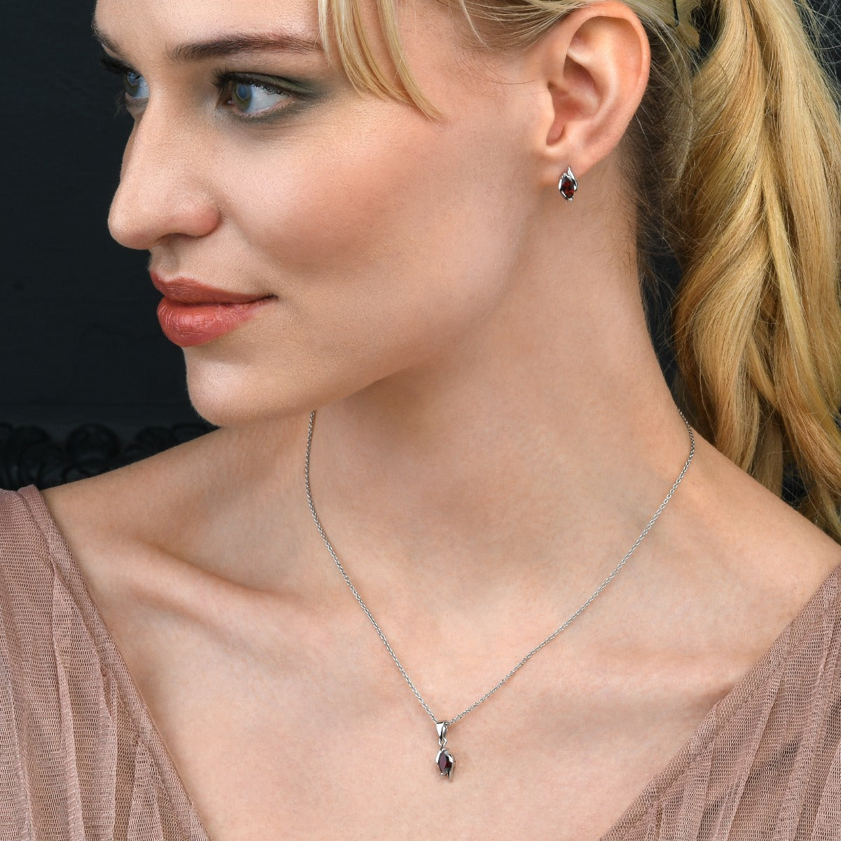 Marquise Shaped Garnet Stud Earrings in Sterling Silver
