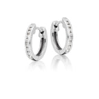 Channel set 0.25ct diamond hoop earrings in 18K white gold