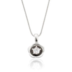 Flower solitaire 0.20ct round diamond pendant in 18K white gold