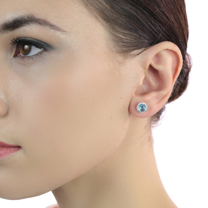 2.00ct Blue Topaz And 0.12ct Diamond Stud Earrings In 18K White Gold