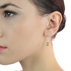  7mm x 9mm Citrine and 0.33ct diamond earrings in 18K white gold