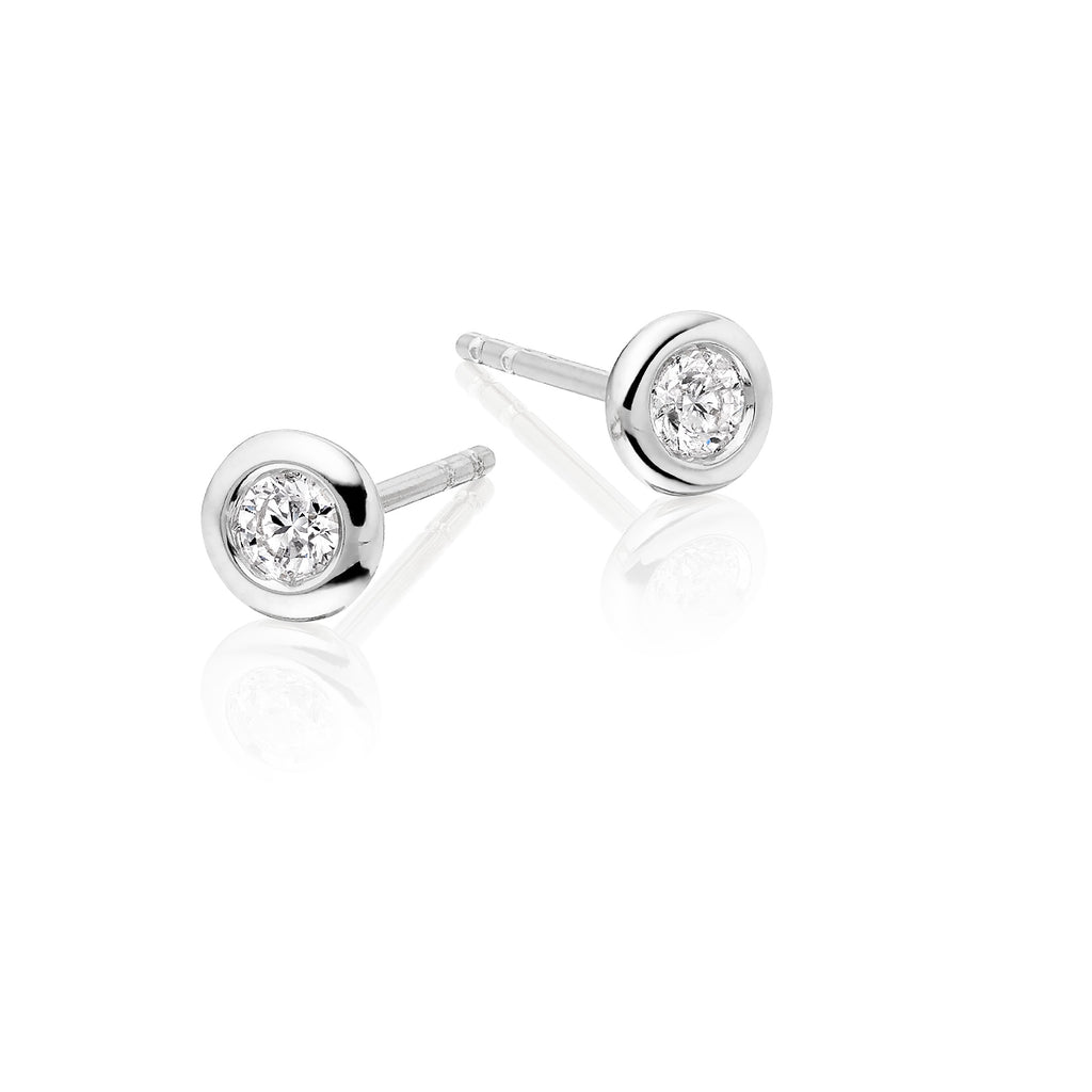 Solitaire 0.20ct Bezel set round diamond studs in 18K white gold