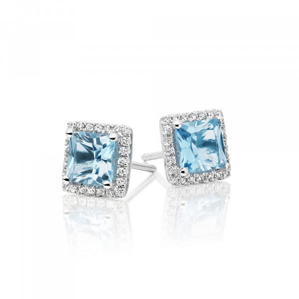 1.80ct Blue Topaz And 0.19ct Diamond Stud Earrings In 9K White Gold